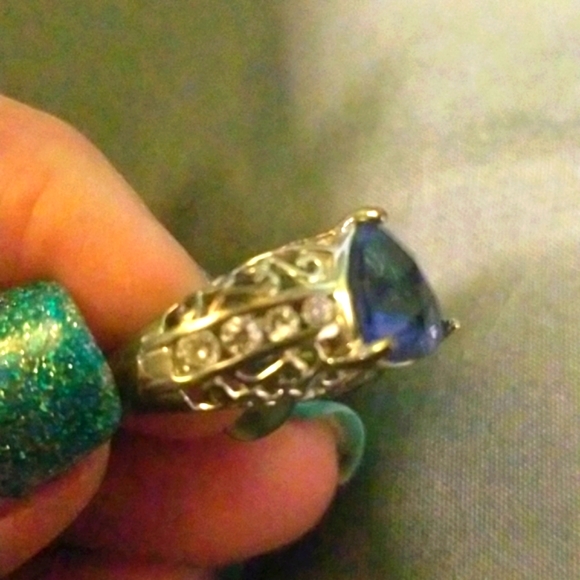 Sterling silver with cz and tanzanite center stone. - Picture 2 of 4